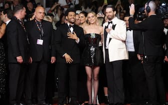 CANNES, FRANCE - MAY 22: (L-R) Abel “The Weeknd” Tesfaye, Lily-Rose Depp and Sam Levinson attend the "The Idol" red carpet during the 76th annual Cannes film festival at Palais des Festivals on May 22, 2023 in Cannes, France. (Photo by Mike Coppola/Getty Images)