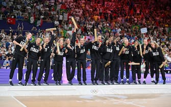 Italy's players celebrate on the podium after winning the Women's gold medal match between USA and Italy of the Volleyball competitions in the Paris 2024 Olympic Games, at the South Paris Arena in Paris, France, 11 August 2024. ANSA/ETTORE FERRARI