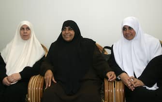 Newly-elected deputies of the Islamist movement Hamas (from L to R) Mariam Farhat, Jamila Al-Shanti, and Huda Naim meet to prepare for the first session of the new Palestinian Legislative Council (PLC) at the home of Hamas leader Ismail Haniyeh in the al-Shatti refugee camp in Gaza City, 17 February 2006. The Hamas-dominated parliament will be sworn in Saturday by Palestinian Authority president Mahmud Abbas. After the swearing in of the new parliament Abbas is to hand responsibility for forming a new government to a new prime minister chosen by Hamas.  AFP PHOTO/MAHMUD HAMS        (Photo credit should read MAHMUD HAMS/AFP via Getty Images)