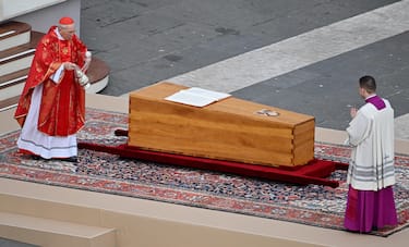 Italian Cardinal Giovanni Battista Re (L) blesses the coffin with the body of Pope Emeritus Benedict XVI (Joseph Ratzinger) during the pontiff's funeral ceremony in Saint Peter's Square, Vatican City, 05 January 2023. Former Pope Benedict XVI died on 31 December 2022 at his Vatican residence, at the age 95. ANSA/ETTORE FERRARI  




