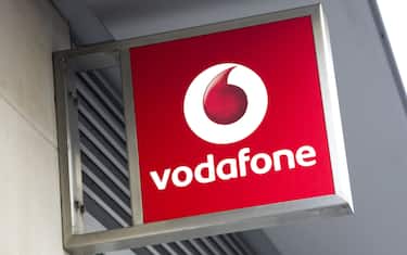 London, England - January 13, 2012: A sign outside a Vodafone shop in Central London. Vodafone, founded in 1984 as Racal Telecom Ltd.,  executed the UK's first mobile phone call just after midnight on the 1st January in 1985.
