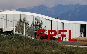 A logo sits on display at the Ecole Polytechnique Federale in Lausanne (EPFL) in Lausanne, Switzerland, on Thursday, Sept. 10, 2020. Humans consume as much cement as food—4 billion tons per year—and producing it accounts for about 7% of global carbon emissions. Photograph by Stefan Wermuth/Bloomberg