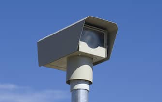 a camera is mounted high to catch speeders