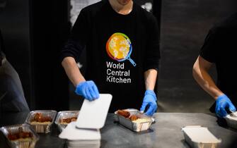 LVIV, UKRAINE - APRIL 22: Chefs and volunteers at World Central Kitchen prepare and package warm meals to be distributed to those in need across the city on April 22, 2022 in Lviv, Ukraine. Beyond refugees arriving in the city, the meals are also provided to workers and volunteers who are helping to keep the city moving. Lviv has served as a stopover and shelter for the millions of Ukrainians fleeing the Russian invasion, either to the safety of nearby countries or the relative security of western Ukraine. (Photo by Leon Neal/Getty Images)