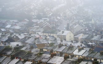 A view of snow covered houses in Dover, Kent, as scattered weather warnings for snow and ice are in place across the UK as temperatures plunged below freezing overnight. The Met Office has issued yellow warnings through Saturday morning for the northern coast and southwest of Scotland, as well as southwest and the eastern coast of England. Picture date: Saturday December 2, 2023. (Photo by Gareth Fuller/PA Images via Getty Images)