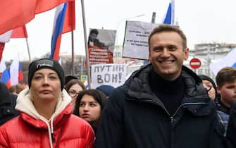 Russian opposition leader Alexei Navalny and his wife Yulia take part in a march in memory of murdered Kremlin critic Boris Nemtsov in central Moscow on February 24, 2019. - The 55-year-old former first deputy prime minister under Boris Yeltsin was shot in the back several times just before midnight on February 27, 2015 as he walked across a bridge a stone's throw from the Kremlin walls. (Photo by Kirill KUDRYAVTSEV / AFP)        (Photo credit should read KIRILL KUDRYAVTSEV/AFP via Getty Images)