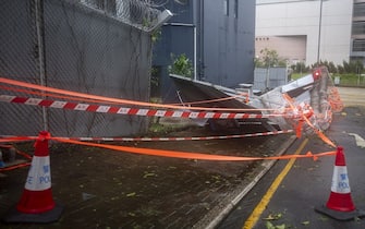 A damaged wall at the West Kowloon Regional Police Headquarters following Super Typhoon Saola in Hong Kong, China, on Saturday, Sept. 2, 2023. Severe Typhoon Saola began to weaken and gradually depart Hong Kong, after bringing hurricane-force winds and heavy rain to the territory. Photographer: Justin Chin/Bloomberg via Getty Images
