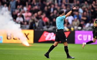 AMSTERDAM - Referee Serdar Gozubuyuk stops the match during the Dutch Eredivisie match between Ajax and Feyenoord at the Johan Cruijff ArenA on September 24, 2023 in Amsterdam, Netherlands. ANP OLAF KRAAK (Photo by ANP via Getty Images)