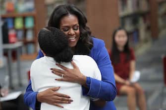 CHICAGO, IL - NOVEMBER 12:  Former first lady Michelle Obama receives a hug from a student as she meets with 20 high school senior girls at Whitney Young Magnet School on November 12, 2018 in Chicago, Illinois. Obama is in town to kick off a tour to promote her book 'Becoming' which is being released tomorrow. Whitney Young Magnet School is where Michelle Obama attended high school. (Photo by Scott Olson/Getty Images)