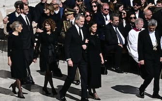 Spain's King Felipe VI (C) and Spain's Queen Letizia walk as they arrive ahead of late Pope Francis' funeral ceremony at St Peter's Square at the Vatican on April 26, 2025. (Photo by Filippo MONTEFORTE / AFP) (Photo by FILIPPO MONTEFORTE/AFP via Getty Images)          