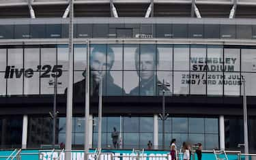 LONDON, UNITED KINGDOM - 2024/08/28: Screens at Wembley Stadium advertise the forthcoming gigs by Oasis, currently scheduled to play five nights in July and August 2025 at the famous stadium. The Manchester rock band, led by Noel and Liam Gallagher, recently announced a reunion tour after 15 years. (Photo by Vuk Valcic/SOPA Images/LightRocket via Getty Images)