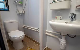 A General view showing the toilet inside a mock-up unit of Light Public Housing on January 30, 2023 in Hong Kong, China. The light public housing scheme aims to temporarily relieve demand for public housing as the government strives to boost supply. (Photo by Vernon Yuen/NurPhoto via Getty Images)