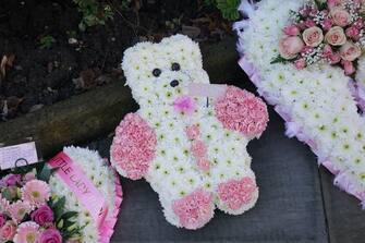 Floral wreaths at the funeral service of baby Indi Gregory, at St Barnabus Cathedral, Nottingham. The baby girl died shortly after her life-support treatment was withdrawn after her parents, Dean Gregory and Claire Staniforth who are both in their 30s and from Ilkeston, Derbyshire, lost legal bids in the High Court and Court of Appeal in London for specialists to keep treating her. Picture date: Friday December 1, 2023.