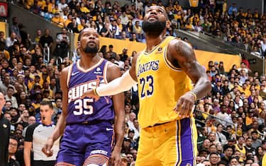 LOS ANGELES, CA - OCTOBER 26: Kevin Durant #35 of the Phoenix Suns and LeBron James #23 of the Los Angeles Lakers waits for a rebound during the game on October 26, 2023 at Crypto.Com Arena in Los Angeles, California. NOTE TO USER: User expressly acknowledges and agrees that, by downloading and/or using this Photograph, user is consenting to the terms and conditions of the Getty Images License Agreement. Mandatory Copyright Notice: Copyright 2023 NBAE (Photo by Andrew D. Bernstein/NBAE via Getty Images) 
