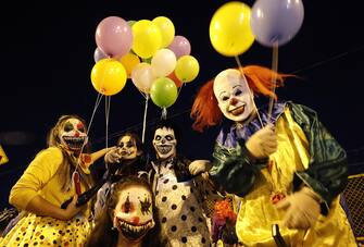 epa08787329 Young people celebrate Halloween in the vicinity of the Nemesio Camacho El Campín stadium, in Bogota, Colombia, early 31 October 2020. Colombia is preparing for an atypical Halloween celebration, a party in which on the night of 31 October, children usually go out in disguise to ask for sweets on the streets of towns and cities, some of which decreed curfews to prevent crowds from spreading plus the pandemic.  EPA/Mauricio Duenas Castaneda