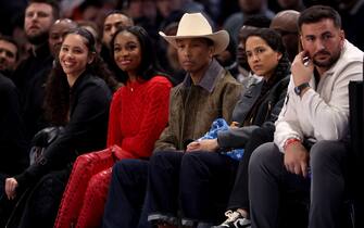 US musician Pharrell Williams (C) attends the NBA regular season basketball match between the Cleveland Cavaliers and the Brooklyn Nets at the Accor Arena in Paris on January 11, 2024. (Photo by EMMANUEL DUNAND / AFP)