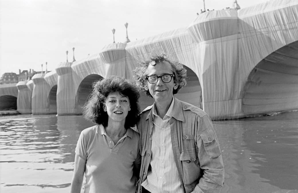 Christo and Jeanne-Claude at The Pont Neuf Wrapped. Paris, 1985. Photo: Wolfgang Volz© 1985 Christo and Jeanne-Claude Foundation