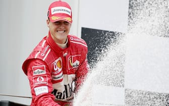 BARCELONA, SPAIN - MAY 9:  Michael Schumacher of Germany and Ferrari celebrates winning the Spanish F1 Grand Prix on May 9, 2004, at the Circuit de Catalunya in Barcelona, Spain. (Photo by Clive Mason/Getty Images)  *** Local Caption *** Michael Schumacher 