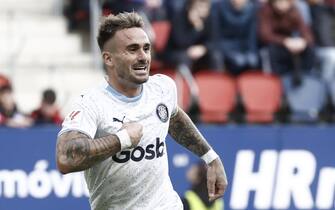 epa10957557 Girona's Aleix Garcia celebrates scoring the 2-4 goal during the Spanish LaLiga soccer match between CA Osasuna and Girona CF in Pamplona, Spain, 04 November 2023.  EPA/Jesus Diges