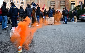 A smoke-bomb during a rally held next to Prefecture of Genoa to contest ministers Matteo Piantedosi and Matteo Salvini after Pisa clashes in Genoa, Italy, 4 March 2024. ANSA/SIMONE ARVEDA