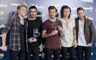 One Direction ****File Photo** ZAYN MALIK QUITS ONE DIRECTION
Pop star ZAYN MALIK has quit ONE DIRECTION, six days after walking out on the British boy band's tour of Asia due to stress.
The 22-year-old singer jetted back to the U.K. following a storm of publicity about his private life, prompted by photos of him holding a young woman's hand during a night out in Thailand.
Malik is engaged to Little Mix singer Perrie Edwards.
The Best Song Ever hitmakers pressed on with the gigs as a foursome, and now they have revealed Malik will not return to the line-up.
A statement posted on the group's Facebook.com page from Malik reads: "My life with One Direction has been more than I could ever have imagined. But, after five years, I feel like it is now the right time for me to leave the band.
"I'd like to apologise to the fans if I've let anyone down, but I have to do what feels right in my heart. I am leaving because I want to be a normal 22-year-old, who is able to relax and have some private time out of the spotlight. I know I have four friends for life in Louis, Liam, Harry and Niall. I know they will continue to be the best band in the world."
His bandmates add, "We're really sad to see Zayn go, but we totally respect his decision and send him all our love for the future. The past five years have been beyond amazing, we've gone through so much together, so we will always be friends. The four of us will now continue. We're looking forward to recording the new album and seeing all the fans on the next stage of the world tour."
And Simon Cowell, who signed the band after the singers appeared as contestants on his U.K. talent show The X Factor, states: "I would like to say thank you to Zayn for everything he has done for One Direction. Since I first met Zayn in 2010, I have grown very, very fond - and immensely proud - of him. I have seen him grow in confidence and I am truly sorry to see him leave. As for One Direction, fans can rest assured that Niall, Liam, Harry and Louis are