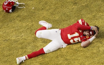 epa11146614 Kansas City Chiefs Patrick Mahomes lies on the field and celebrates after the Kansas City Chiefs defeated the San Fransisco 49ers in Super Bowl LVIII at Allegiant Stadium in Las Vegas, Nevada, USA, 11 February 2024. The Super Bowl is the annual championship game of the NFL between the AFC Champion and the NFC Champion and has been held every year since 1967.  EPA/CAROLINE BREHMAN
