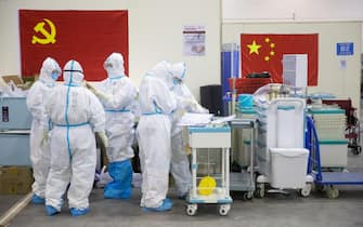 epa08224971 Medical staff in protective suits work at Wuhan Fang Cang makeshift hospital in Wuhan, Hubei Province, China, 17 February 2020 (issued 18 February 2020). The disease caused by the novel coronavirus (SARS-CoV-2) has been officially named COVID-19 by the World Health Organization (WHO). The outbreak, which originated in the Chinese city of Wuhan, has so far killed more than 1,800 people with over 73,000 infected worldwide, mostly in China.  EPA/STRINGER CHINA OUT