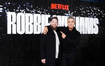 Robbie Williams and Joe Pearlman arrive for the Robbie Williams Netflix documentary launch event at the London Film Museum in Covent Garden, London. Picture date: Wednesday November 1, 2023.
