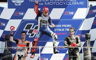 Dani Pedrosa spanish rider Repsol Honda Team (L)  Jorge Lorenzo spanish rider Yamaha Factory Racing (C) Cal Crutchlow inglish rider Monster Yamaha Tech 3 (R) celebrates on the podium after the Grand Prix of Italy at the Mugello circuit, central Italy, 2 June  2013. ANSA/CARLO   