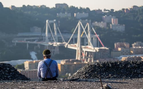 A man watch the collapsed Morandi Bridge, in Genoa, Italy, on June 28, 2019. The giant motorway bridge collapsed on August 14, 2018 killing 43 people. The collapse, which saw a vast stretch of the A10 freeway tumble on to railway lines in the northern port city, was the deadliest bridge failure in Italy for years. (Photo by Mauro Ujetto/NurPhoto via Getty Images)