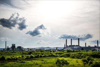 View of old power plant with big concrete furnaces . Fallen chemical communist industry.