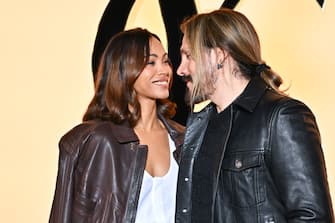 PARIS, FRANCE - FEBRUARY 27: (EDITORIAL USE ONLY - For Non-Editorial use please seek approval from Fashion House) Zoe Saldana and Marco Perego attend the Saint Laurent Womenswear Fall/Winter 2024-2025 show as part of Paris Fashion Week on February 27, 2024 in Paris, France. (Photo by Stephane Cardinale - Corbis/Corbis via Getty Images)