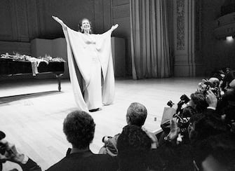 (Original Caption) 3/5/1974-New York, NY- Soprano Maria Callas greets the audience after a concert in New York's Carnegie Hall. Singing a program of Italian and French operatic solos and duets with tenor Giuseppe di Stefano, Miss Callas made her first appearance in New York in almost ten years. One New York critic said that it "would be silly to pretend that Miss Callas has much voice left," but added, "she remains an artist...."