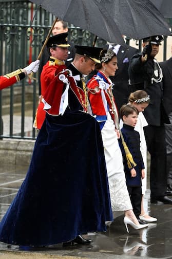 Britain's Prince William, Prince of Wales, Britain's Catherine, Princess of Wales, Britain's Princess Charlotte of Wales and Britain's Prince Louis of Wales arrive at Westminster Abbey in central London on May 6, 2023, ahead of the coronations of Britain's King Charles III and Britain's Camilla, Queen Consort. - The set-piece coronation is the first in Britain in 70 years, and only the second in history to be televised. Charles will be the 40th reigning monarch to be crowned at the central London church since King William I in 1066. Outside the UK, he is also king of 14 other Commonwealth countries, including Australia, Canada and New Zealand. Camilla, his second wife, will be crowned queen alongside him, and be known as Queen Camilla after the ceremony. (Photo by TOBY MELVILLE / POOL / AFP) (Photo by TOBY MELVILLE/POOL/AFP via Getty Images)