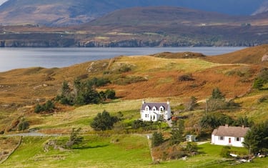 The Cuillin Hills, widely regarded as Britain's most spectacular mountain range, dominate the Isle of Skye. The village of Tarskavaig on the Sleat Peninsula affords a fine view of the range.