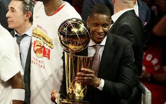 OAKLAND, CA - JUNE 13: President of Basketball Operations Masai Ujiri holds the Larry O'Brien Championship Trophy after Game Six of the NBA Finals against the Golden State Warriors on June 13, 2019 at ORACLE Arena in Oakland, California. NOTE TO USER: User expressly acknowledges and agrees that, by downloading and/or using this photograph, user is consenting to the terms and conditions of Getty Images License Agreement. Mandatory Copyright Notice: Copyright 2019 NBAE (Photo by Chris Elise/NBAE via Getty Images)