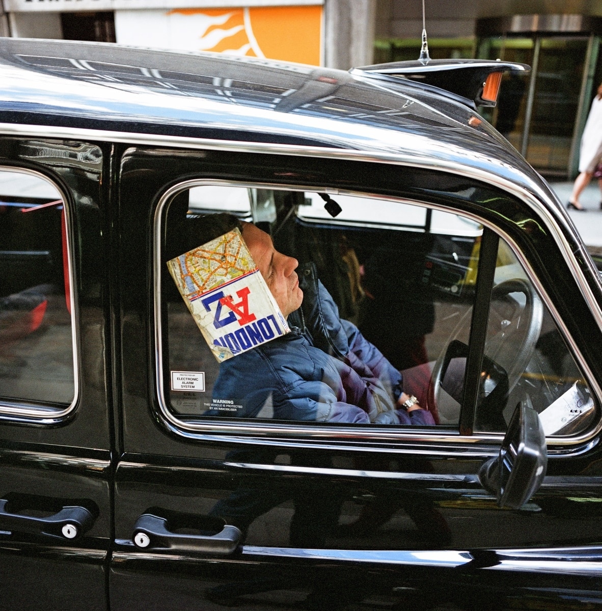 A-sleeping-taxi-driver-in-Lime-Street-City-of-London-c.-1990.-©-Paul-Baldesare.jpg