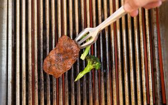 A chef grills a piece of cultivated thin-cut steak in the Aleph Farms Ltd. development kitchen in Rehovot, Israel, on Sunday, Nov. 27, 2022. The UN predicted last year that with the world's population expected to climb by 11% in the coming decade, meat consumption would rise by an even greater 14%. Photographer: Corinna Kern/Bloomberg via Getty Images