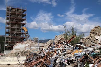 I cantieri nella cittadina di Amatrice, rasa al suolo dal terremoto del 24 agosto 2016, 23 Agosto 2022. ANSA/BASILETTI