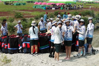 epa10779266 Attendees of the 25th World Scout Jamboree arrive at a scout camping site in the Saemangeum reclamation area in Buan, North Jeolla Province, on South Korea's west coast, 01 August 2023, as the international event kicks off later in the day for a 12-day run.  EPA/YONHAP SOUTH KOREA OUT