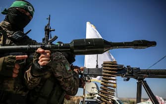 

Palestinian fighters from the armed wing of Hamas are taking part in a military parade in front of an Israeli military site to mark the anniversary of the 2014 war with Israel, near the border in the central Gaza Strip, on July 19, 2023. (Photo by Majdi Fathi/NurPhoto)