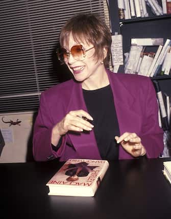 WEST HOLLYWOOD, CA - NOVEMBER 30:   Actress Shirley MacLaine autographs copies of her new book "Dance While You Can" on November 30, 1991 at Book Soup in West Hollywood, California. (Photo by Ron Galella, Ltd./Ron Galella Collection via Getty Images) 
