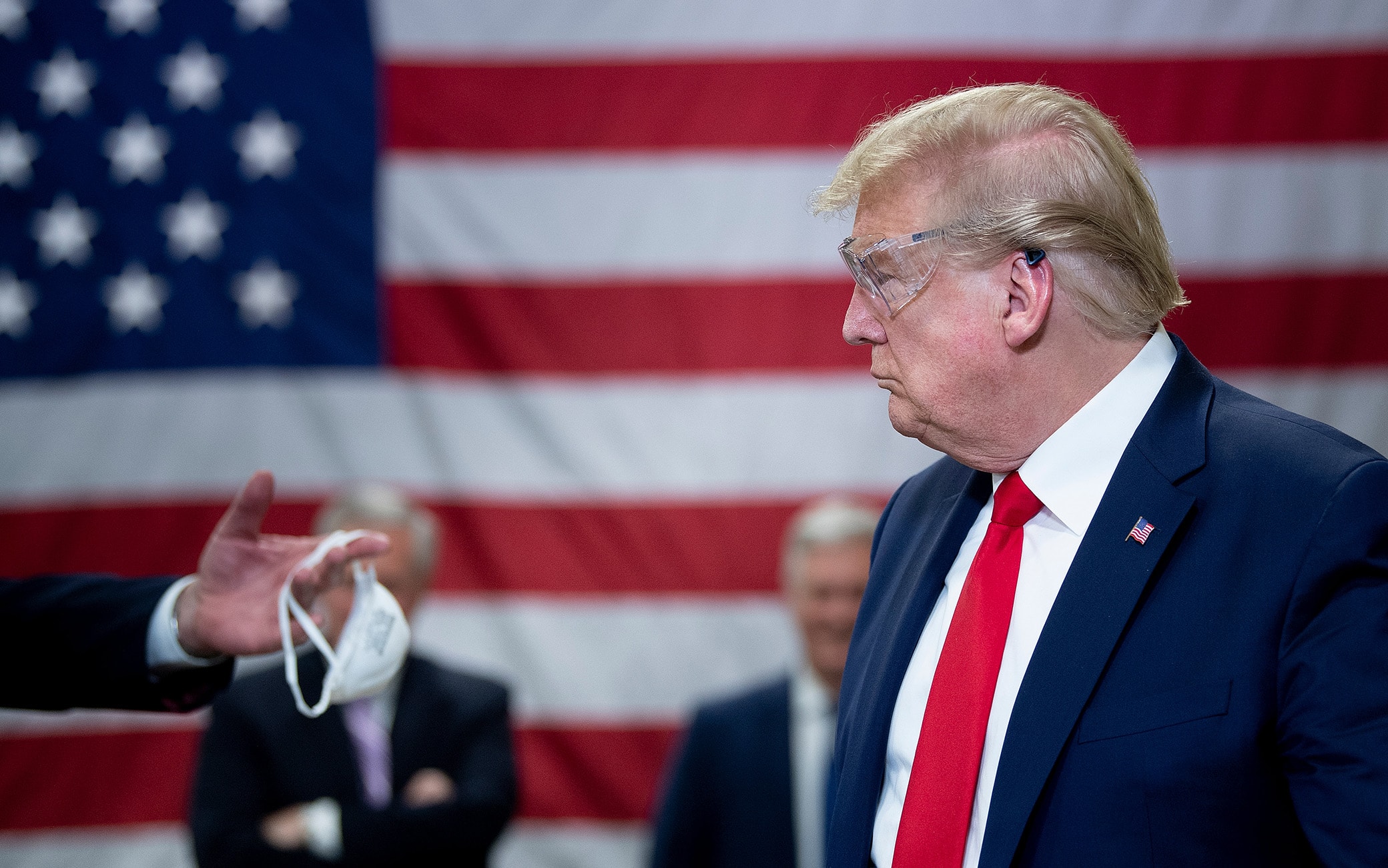 TOPSHOT - US President Donald Trump tours a Honeywell International Inc. factory producing N95 masks during his first trip since widespread COVID-19 related lockdowns went into effect May 5, 2020, in Phoenix, Arizona. (Photo by Brendan Smialowski / AFP) (Photo by BRENDAN SMIALOWSKI/AFP via Getty Images)