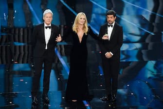 SANREMO, ITALY - FEBRUARY 06:  (L-R) Claudio Baglioni, Michelle Hunziker  and Pierfrancesco Favino attend the first night of the 68. Sanremo Music Festival on February 6, 2018 in Sanremo, Italy.  (Photo by Venturelli/WireImage)