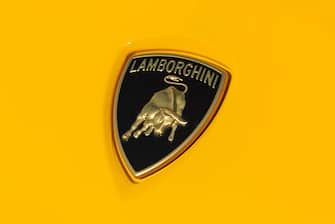 ISTANBUL, TURKEY - OCTOBER 15, 2023: Lamborghini logo on a yellow car body.