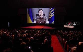 epa09953398 Ukraine's President Volodymyr Zelensky appears on a screen during the Opening Ceremony of the 75th annual Cannes Film Festival, in Cannes, France, 17 May 2022. The festival runs from 17 to 28 May.  EPA/CLEMENS BILAN
