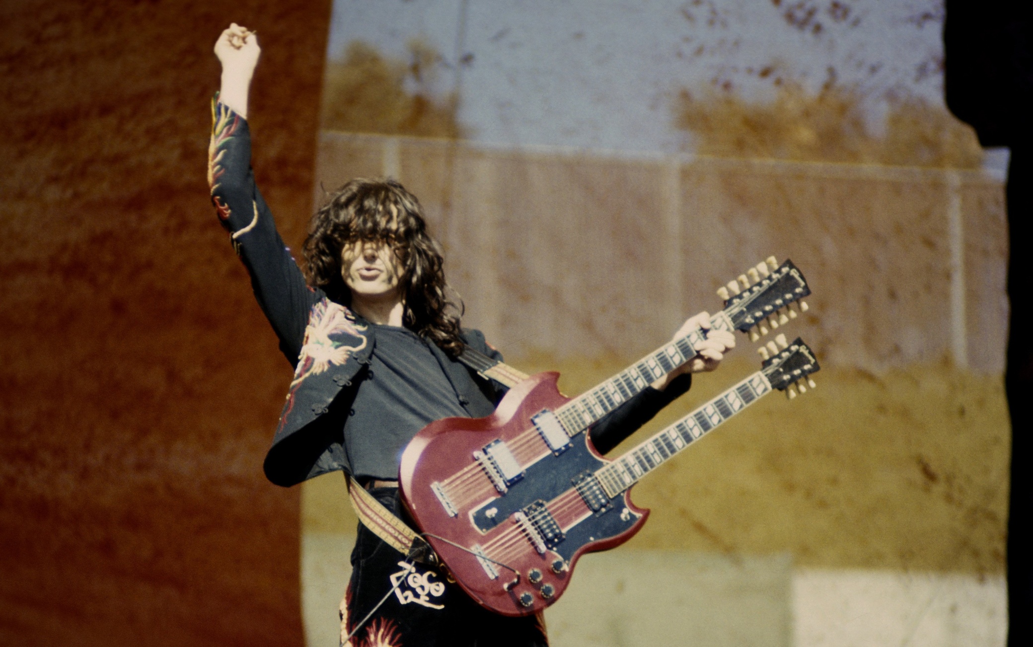 OAKLAND, CA -  JULY 23:  Jimmy Page performing with 'Led Zeppelin at the Oakland Coliseum in Oakland, California on July 23, 1977. (Photo by Larry Hulst/Michael Ochs Archives/Getty Images)