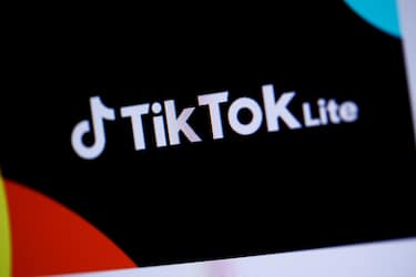 This photograph taken on April 11, 2024, in Paris, shows the logo of the Chinese social network application TikTok Lite. The social network TikTok, owned by the Chinese company ByteDance, has launched a new application in France and Spain, called TikTok Lite, which allows its users to get paid by watching videos, it announced on April 10, 2024. Users aged 18 or older can "collect points by discovering new content or completing certain actions," the social network said. (Photo by Kiran RIDLEY / AFP) (Photo by KIRAN RIDLEY/AFP via Getty Images)