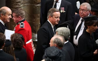 LONDON, ENGLAND - SEPTEMBER 19: Former British Prime Minister David Cameron leaves Westminster Abbey after the State Funeral of Queen Elizabeth II on September 19, 2022 in London, England.  Elizabeth Alexandra Mary Windsor was born in Bruton Street, Mayfair, London on 21 April 1926. She married Prince Philip in 1947 and ascended the throne of the United Kingdom and Commonwealth on 6 February 1952 after the death of her Father, King George VI. Queen Elizabeth II died at Balmoral Castle in Scotland on September 8, 2022, and is succeeded by her eldest son, King Charles III. (Photo by Phil Noble - WPA Pool/Getty Images)