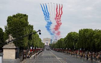 French Air Force elite acrobatic flying team "Patrouille de France" (PAF) performs a fly-over during the Bastille Day military parade on the Champs-Elysees avenue in Paris on July 14, 2023. (Photo by Ludovic MARIN / AFP) (Photo by LUDOVIC MARIN/AFP via Getty Images)